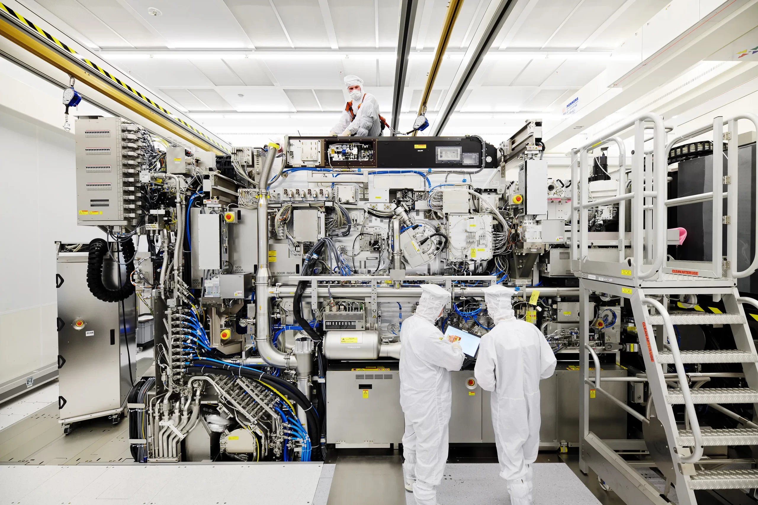 A couple of engineers working in a semiconductor fab